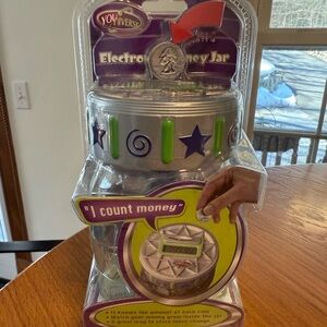 Youniverse electronic money counting jar. New in original package.